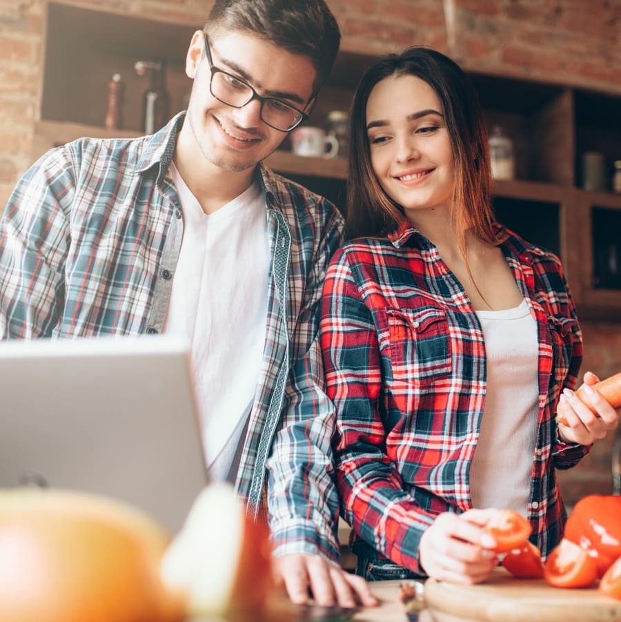 A couple cooking together